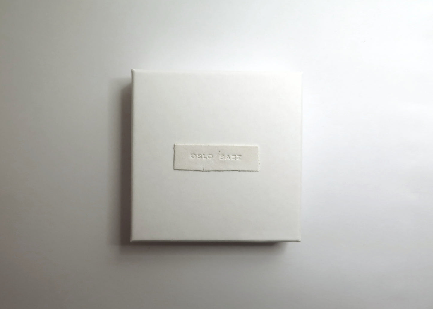 White gift box with handmade clay label