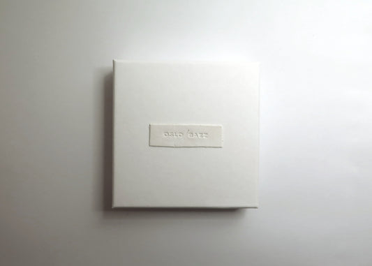 White gift box with handmade clay label